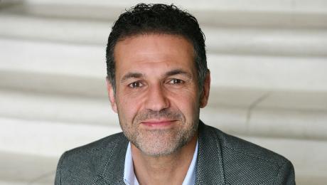 Khaled Hosseini fuller shot publicity photo (c) 2013 by Elena Seibert